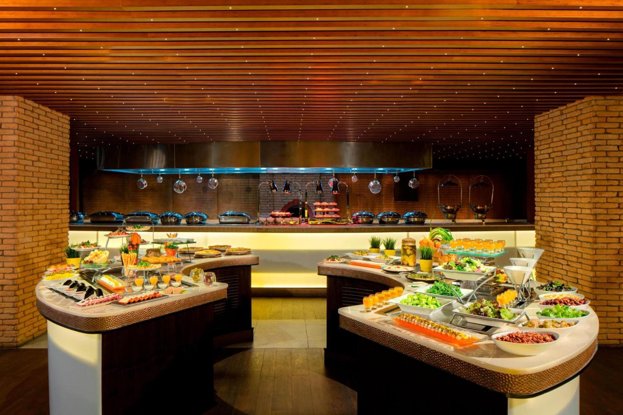 Sheraton Sharjah Beach Resort And Spa Exterior photo The buffet at the restaurant