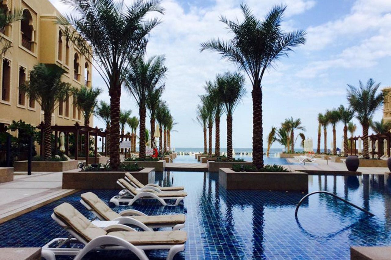Sheraton Sharjah Beach Resort And Spa Exterior photo The pool at the Ritz-Carlton, Ras Al Khaimah